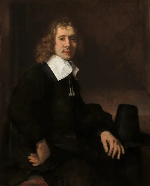 Joven sentado a una mesa (posiblemente Govaert Flinck), Rembrandt van Rijn